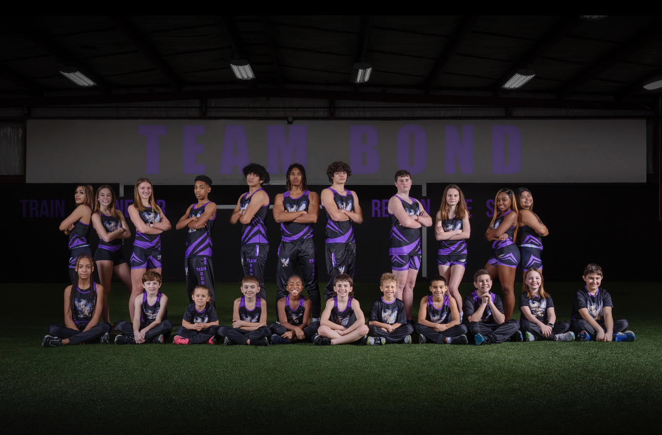 The B.O.N.D. team together in purple and black